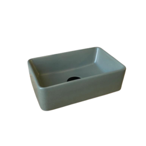 A small rectangle concrete basin with a black waste plug. The basin is a fun deep moss in colour and the background is white.