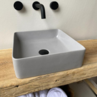 Rounded Square Concrete Vessel Basin Grey in colour on a timber vanity